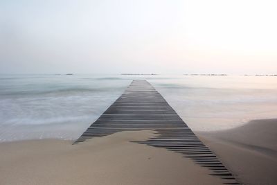 Scenic view of beach against clear sky