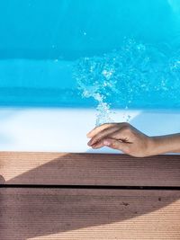 Close-up of hand splashing water