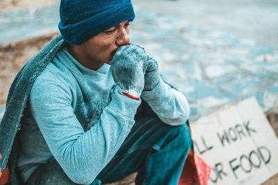 Portrait of young man in snow