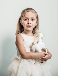 Portrait of a smiling girl over white background