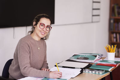 Female teacher working in classroom