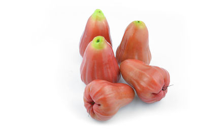 Close-up of fruits over white background