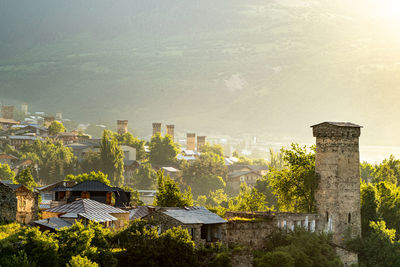 Old buildings in city against sky