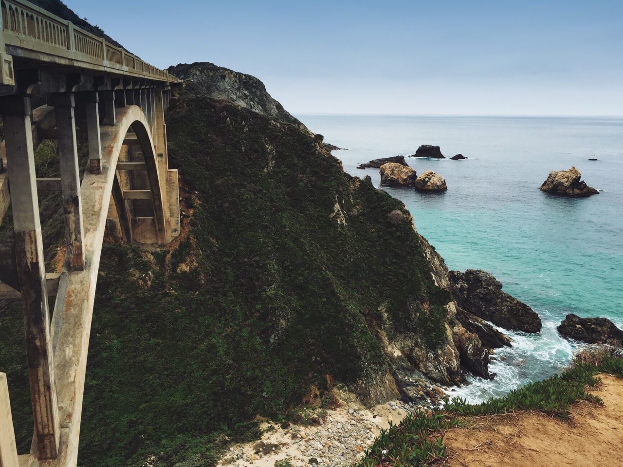 sea, water, horizon over water, clear sky, tranquil scene, scenics, tranquility, blue, beach, beauty in nature, rock - object, nature, built structure, shore, coastline, sky, rock formation, day, idyllic, sunlight