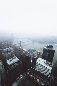 High angle view of buildings in city against sky