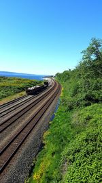 Railroad track against blue sky