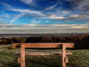 Scenic view of landscape against cloudy sky