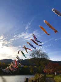 Low angle view of decoration hanging against sky