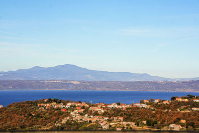 City by sea against sky