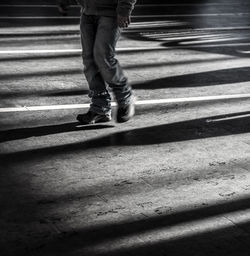 Low section of person walking on staircase