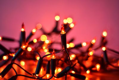 Close-up of illuminated lighting equipment at night