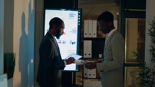 Side view of man working in office