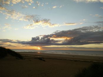 Scenic view of sea at sunset