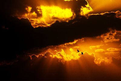 Low angle view of cloudy sky at sunset