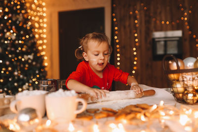 Portrait of cute boy eating food at home