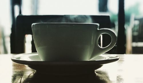 Close-up of coffee cup on table