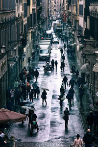 High angle view of people walking in rain