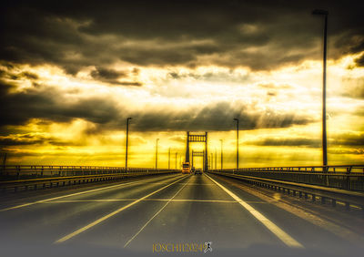 Highway against sky during sunset