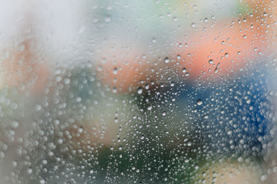 Full frame shot of wet glass window