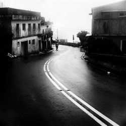 Alley amidst buildings in city