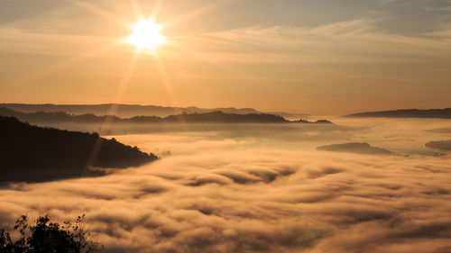 Scenic view of silhouette mountains against sky during sunset