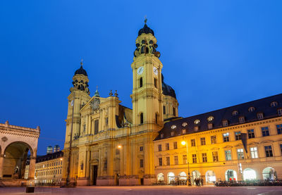 Low angle view of illuminated buildings at night