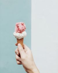 Hand holding ice cream cone