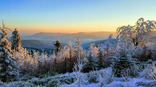 Scenic view of mountains against sky during winter