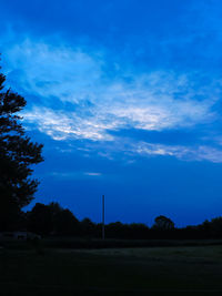 Scenic view of landscape against cloudy sky