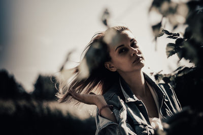 Portrait of young woman looking away