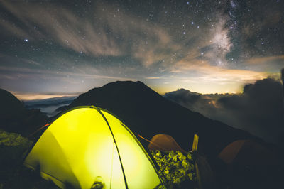 Scenic view of mountains against sky at night