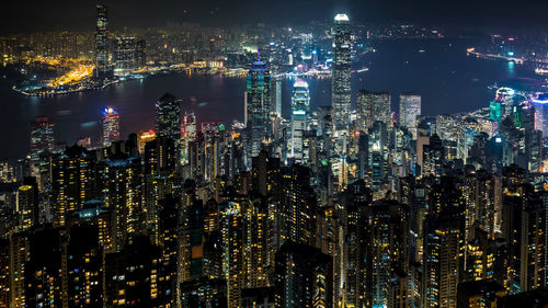 Aerial view of illuminated buildings in city at night