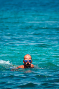 Portrait of man swimming in sea