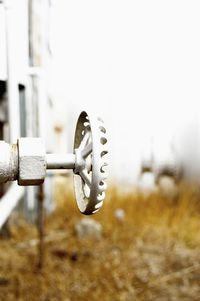 Close-up of fuel storage tank knob on field