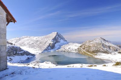 Scenic view of snowcapped mountains against blue sky