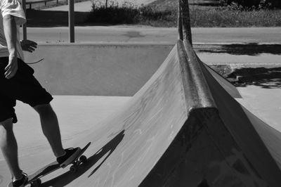 Low section of man skateboarding 