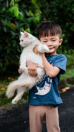 Full length of boy with dog