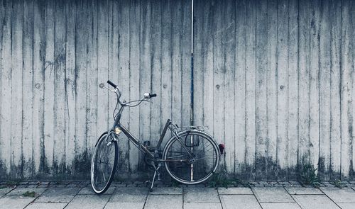 Bicycle leaning against wall