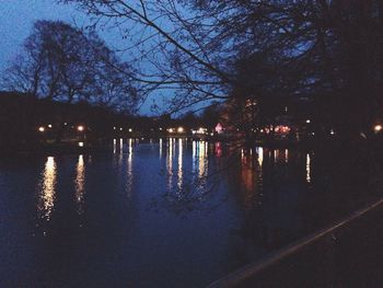 Reflection of trees in water at night