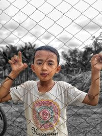 Portrait of boy holding outdoors