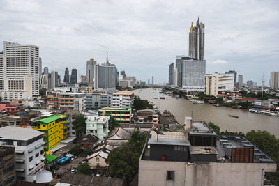 High angle view of buildings in city against sky