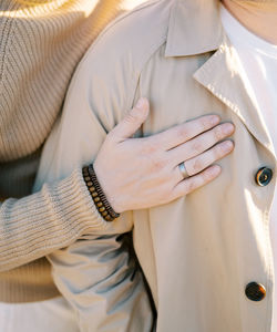 Midsection of woman wearing sweater