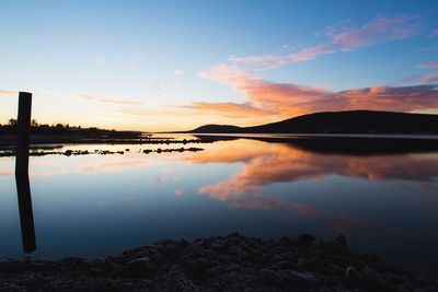 Reflection of clouds in lake during sunset