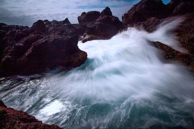 Scenic view of rock formation in sea