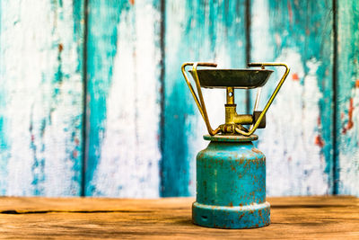 Close-up of old bottle on table