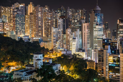 High angle view of illuminated buildings in city at night