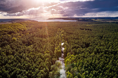 Scenic view of land against sky during sunset