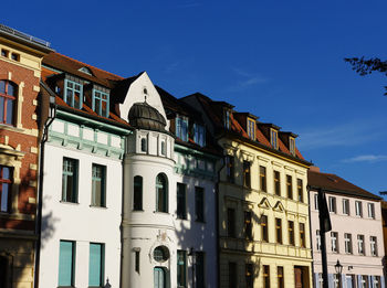 Low angle view of buildings against clear sky