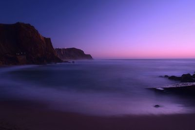 Scenic view of calm sea at dusk