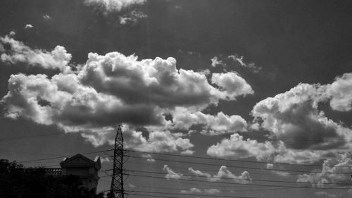 Low angle view of electricity pylon against sky